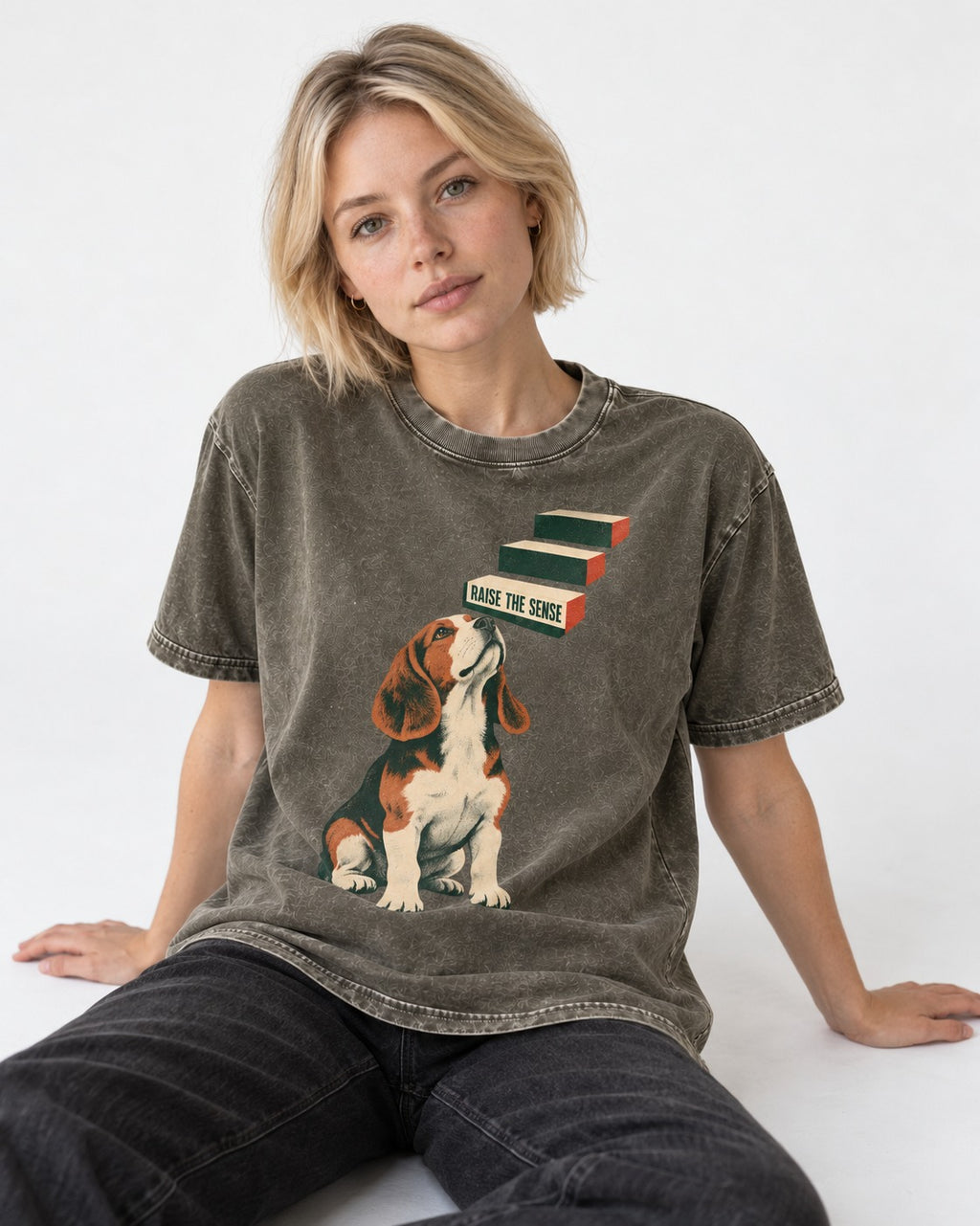 Raise The Sense Beagle Scent Hound Washed Tee in Army Green, worn by a seated model