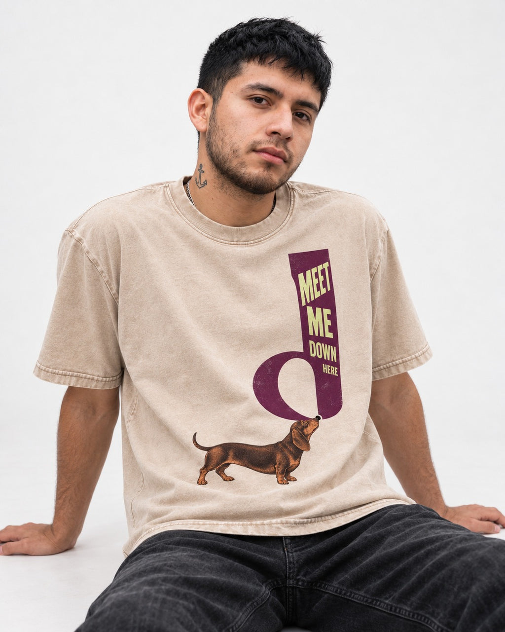 Dachshund Meet Me Down Here Letterform Loop Graphic Washed Tee in Apricot, worn by a seated model