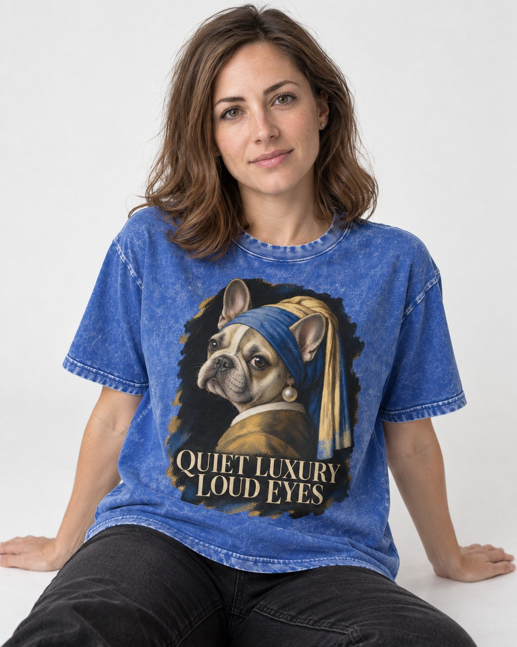 Frenchie Quiet Luxury Loud Eyes Pearl Portrait Graphic Washed Tee in Royal Blue, worn by a seated model