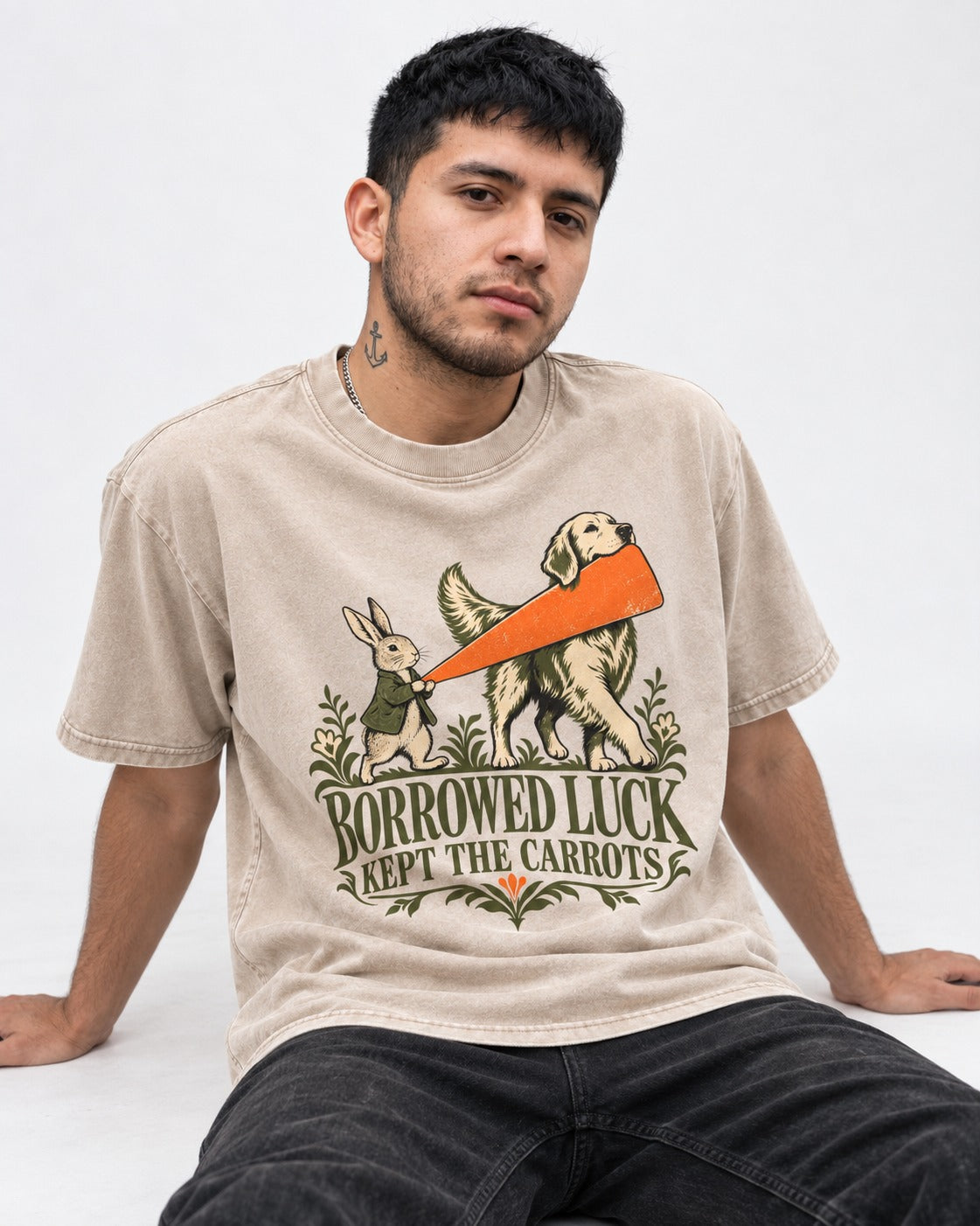 Borrowed Luck Golden Retriever Washed Tee in Apricot, worn by a seated model