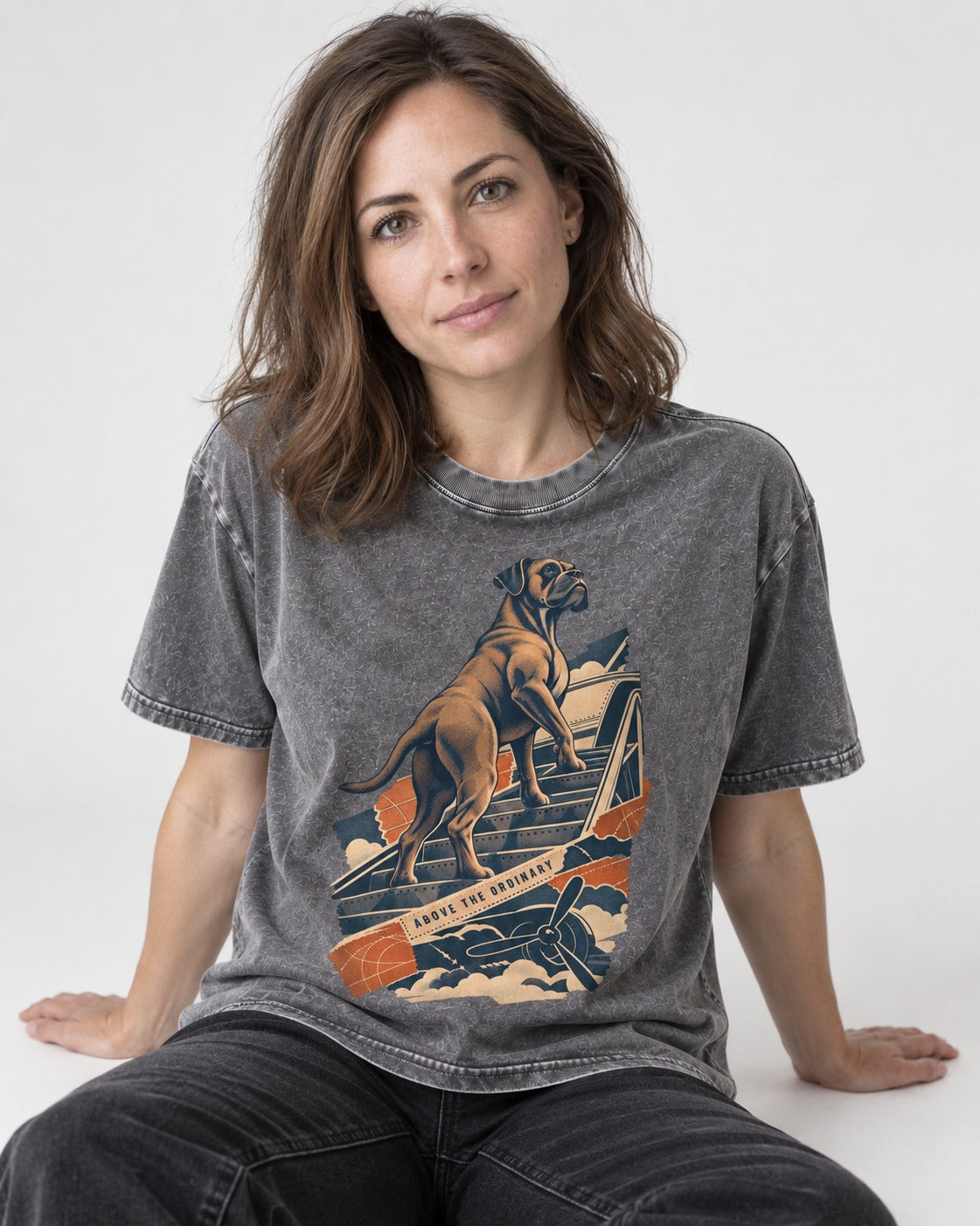 Above the Ordinary Boxer Aviation Graphic Washed Tee in Gray, worn by a seated model