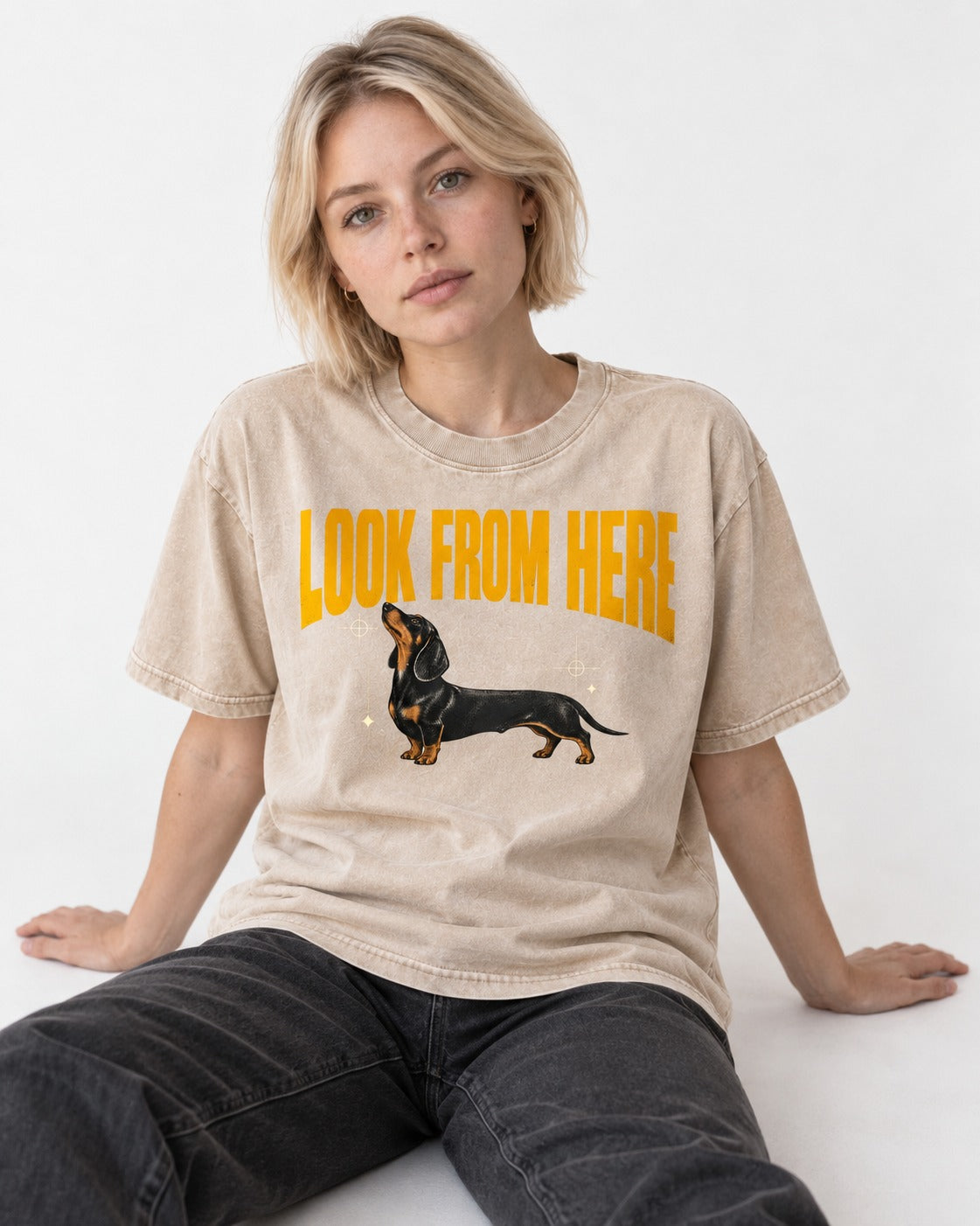 Dachshund Look From Here Washed Tee in Apricot, worn by a seated model