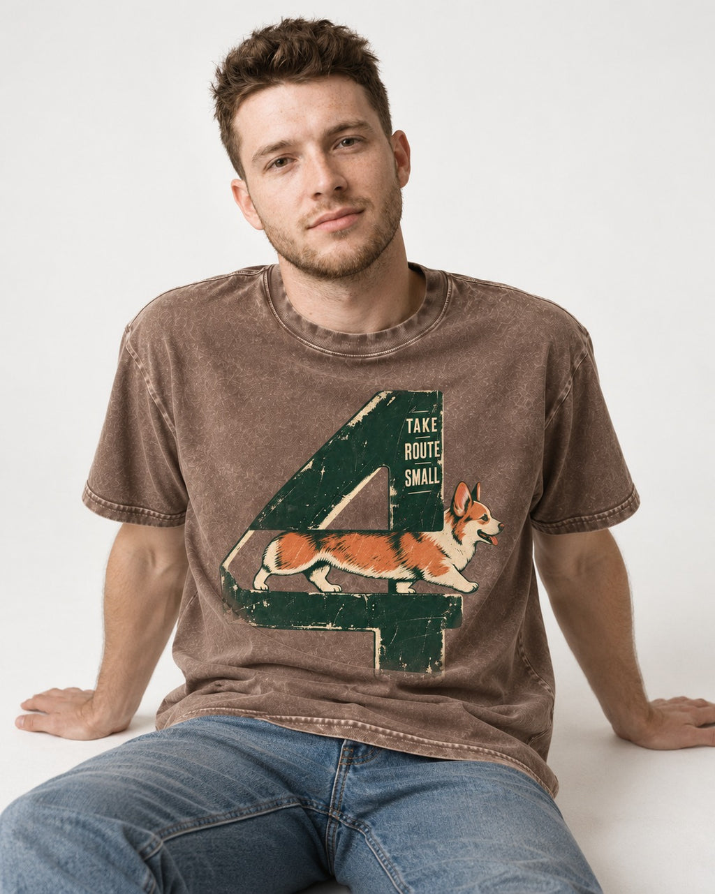 Take Route Small Corgi Washed Tee in Coffee, worn by a seated model