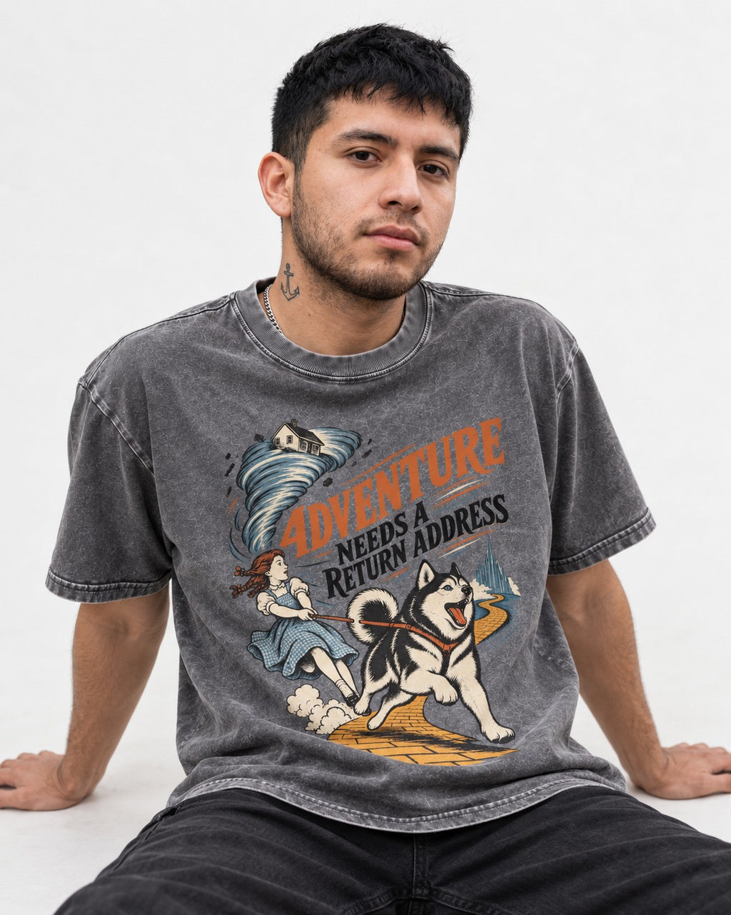 Husky Needs a Return Address Washed Tee in Gray, worn by a seated model