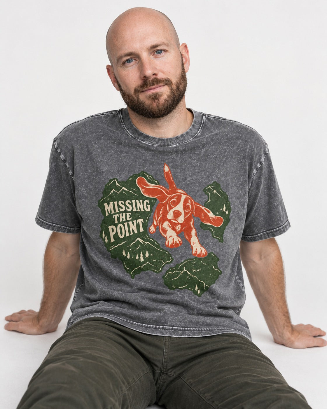 Missing The Point Beagle Trail Washed Tee in Gray, worn by a seated model