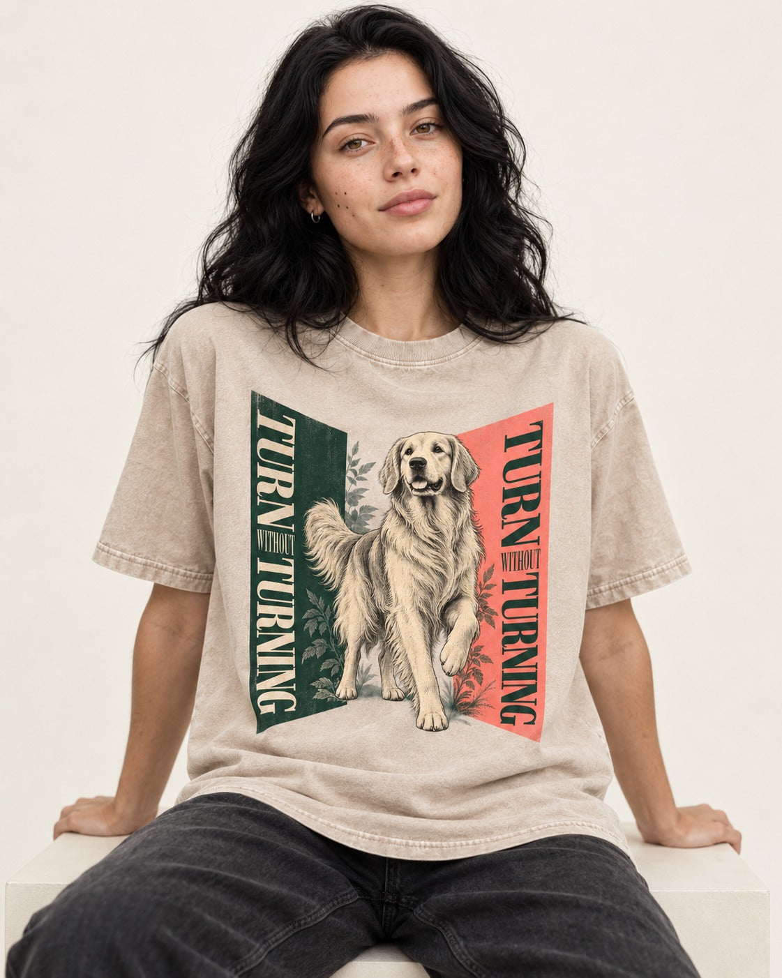 Golden Retriever Turn Without Turning Gateway Graphic Washed Tee in Apricot, worn by a seated model
