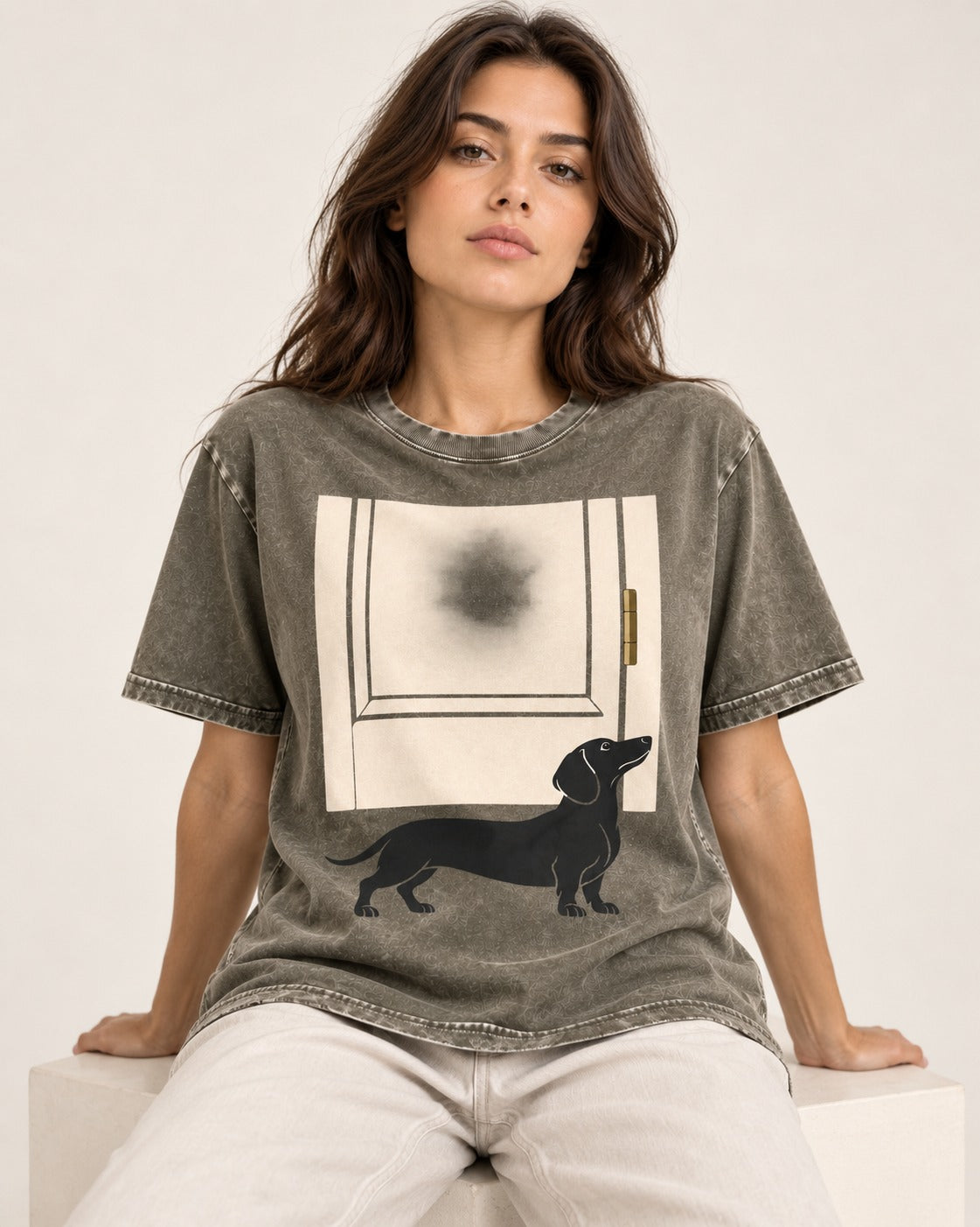 Dachshund Frosted Door Sentinel Graphic Washed Tee in Army Green, worn by a seated model
