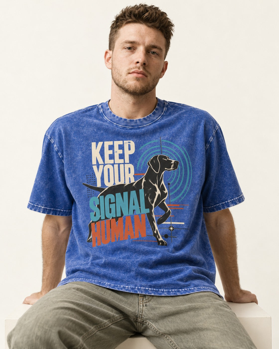 German Shorthaired Pointer Keep Your Signal Human Broadcast Graphic Washed Tee in Royal Blue, worn by a seated model
