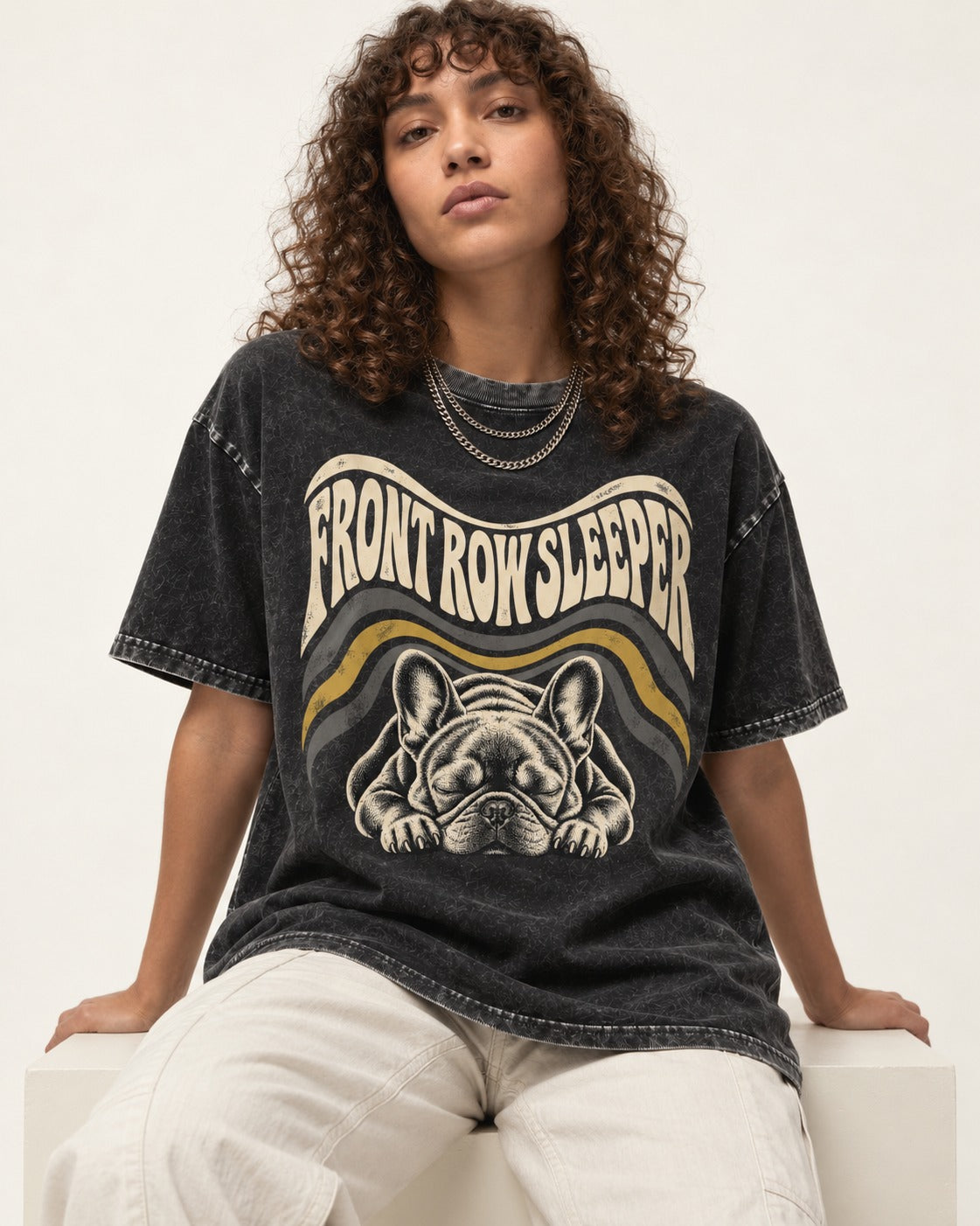 Frenchie Front Row Sleeper Retro Graphic Washed Tee in Black, worn by a seated model