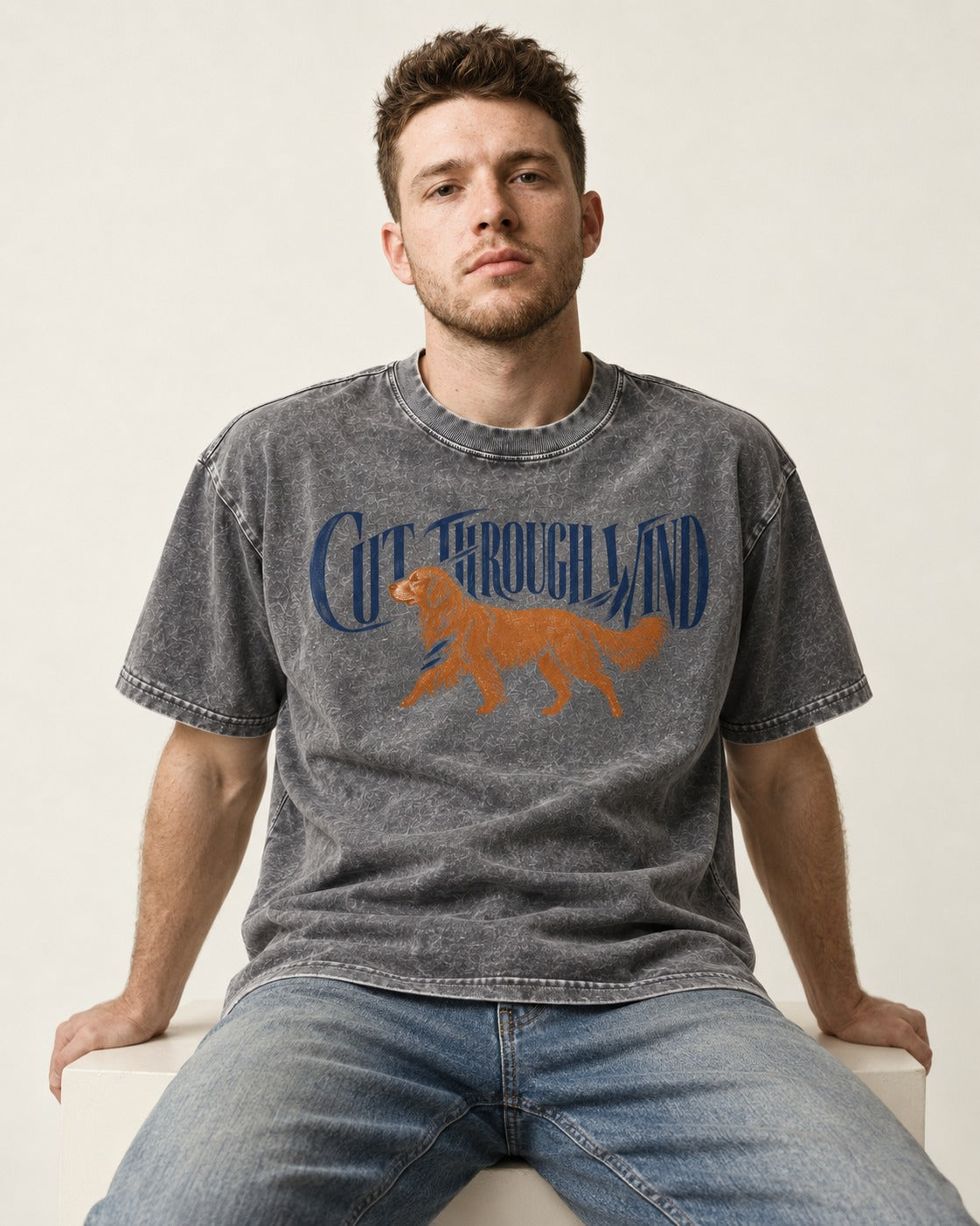 Golden Retriever Cut Through Land Washed Tee in Gray, worn by a seated model