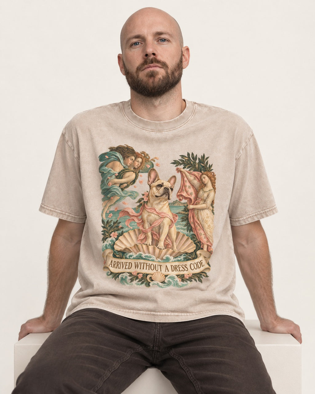 Frenchie Without a Dress Code Washed Tee in Apricot, worn by a seated model