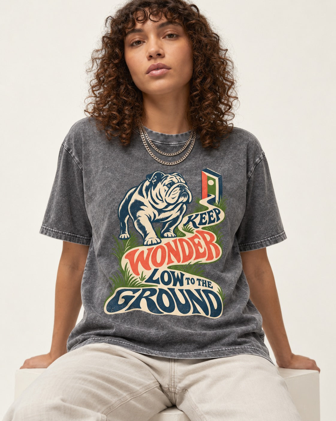 Keep Wonder Low to the Ground English Bulldog Graphic Washed Tee in Gray, worn by a seated model
