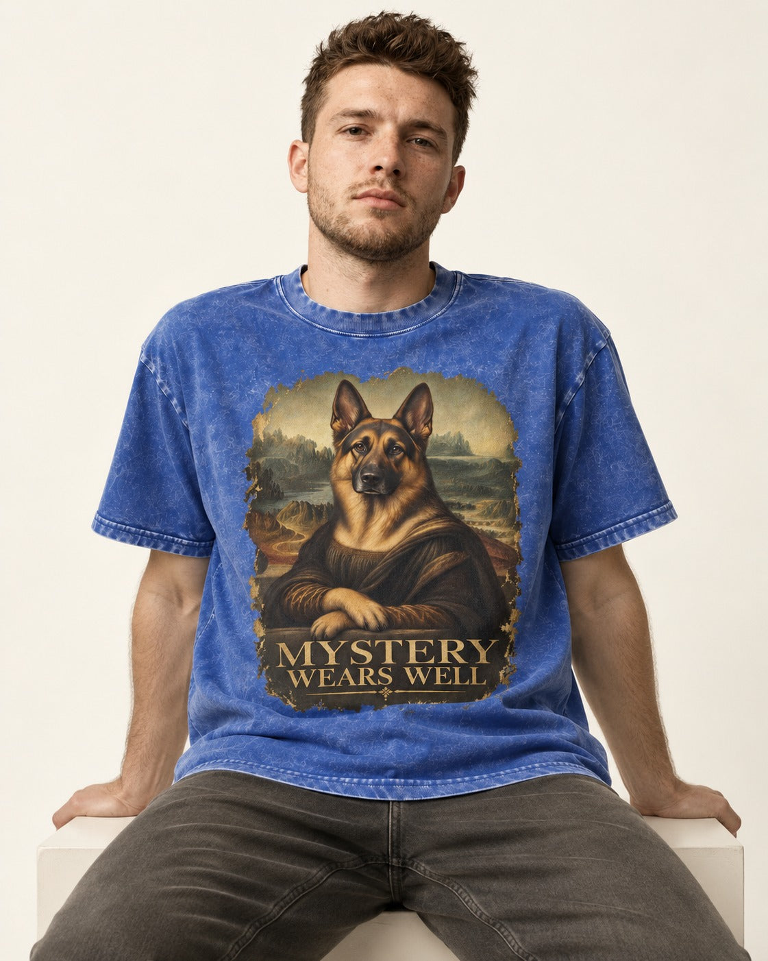 German Shepherd Dog Mystery Wears Well Renaissance Portrait Washed Tee in Royal Blue, worn by a seated model