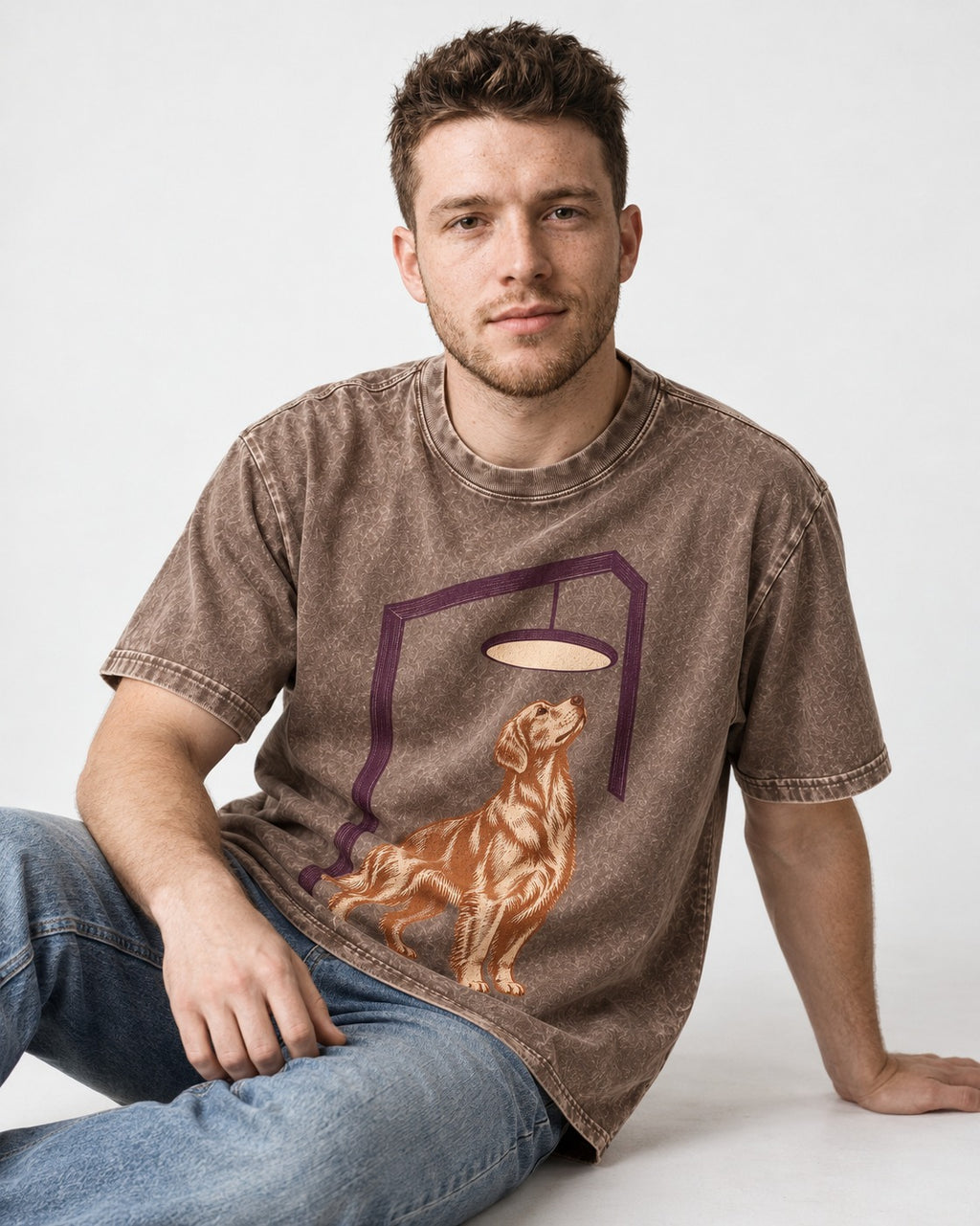 Golden Retriever Bright Idea Washed Tee in Coffee, worn by a seated model