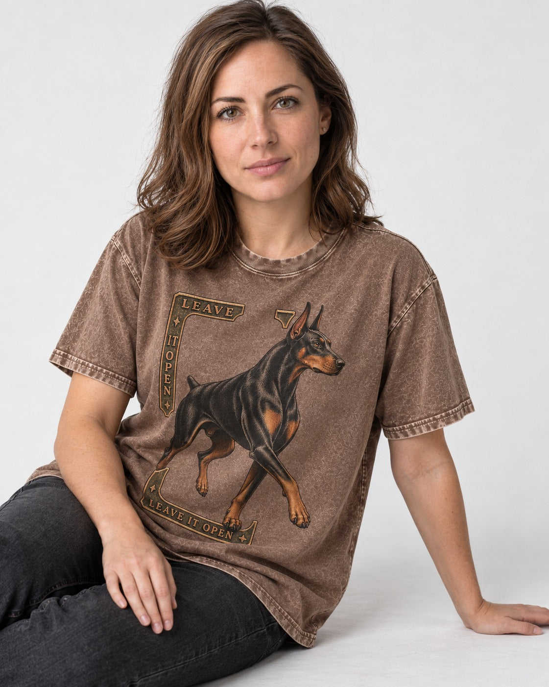 Leave It Open Doberman Washed Tee in Coffee, worn by a seated model