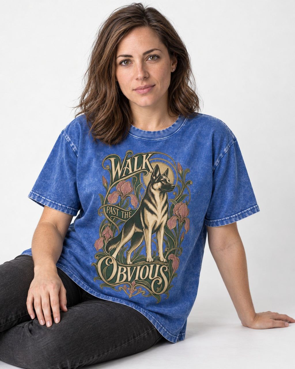 Walk Past The Obvious Art Nouveau German Shepherd Dog Graphic Washed Tee in Royal Blue, worn by a seated model