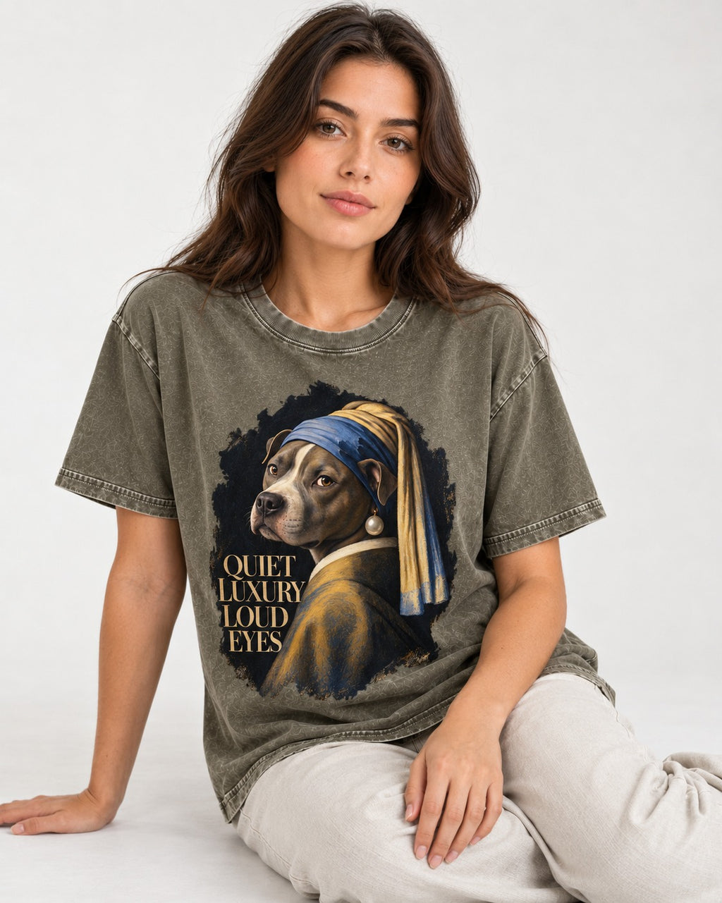 Pitbull Quiet Luxury Loud Eyes Pearl Earring Portrait Graphic Washed Tee in Army Green, worn by a seated model