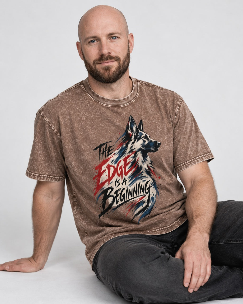 Edge Is a Beginning German Shepherd Dog Washed Tee in Coffee, worn by a seated model