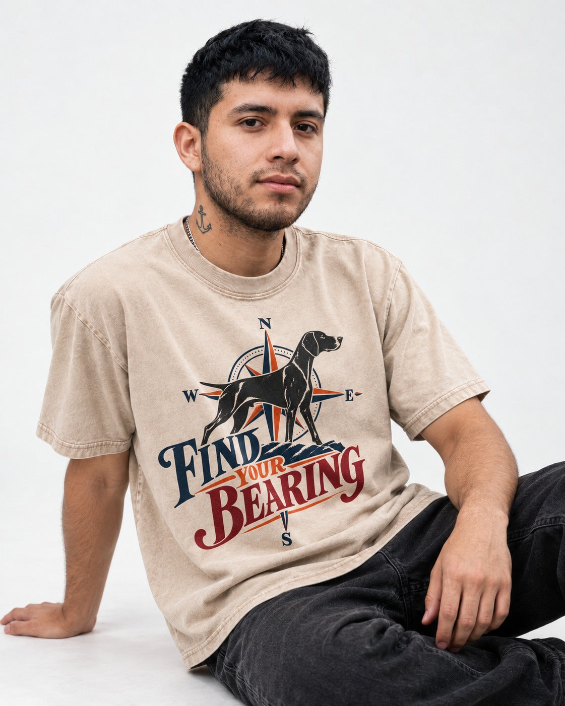 Find Your Bearing German Shorthaired Pointer Washed Tee in Apricot, worn by a seated model