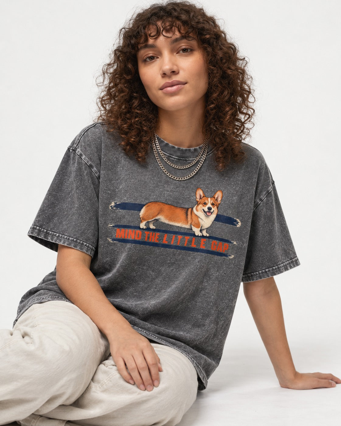 Mind the Little Corgi Gap Washed Tee in Gray, worn by a seated model