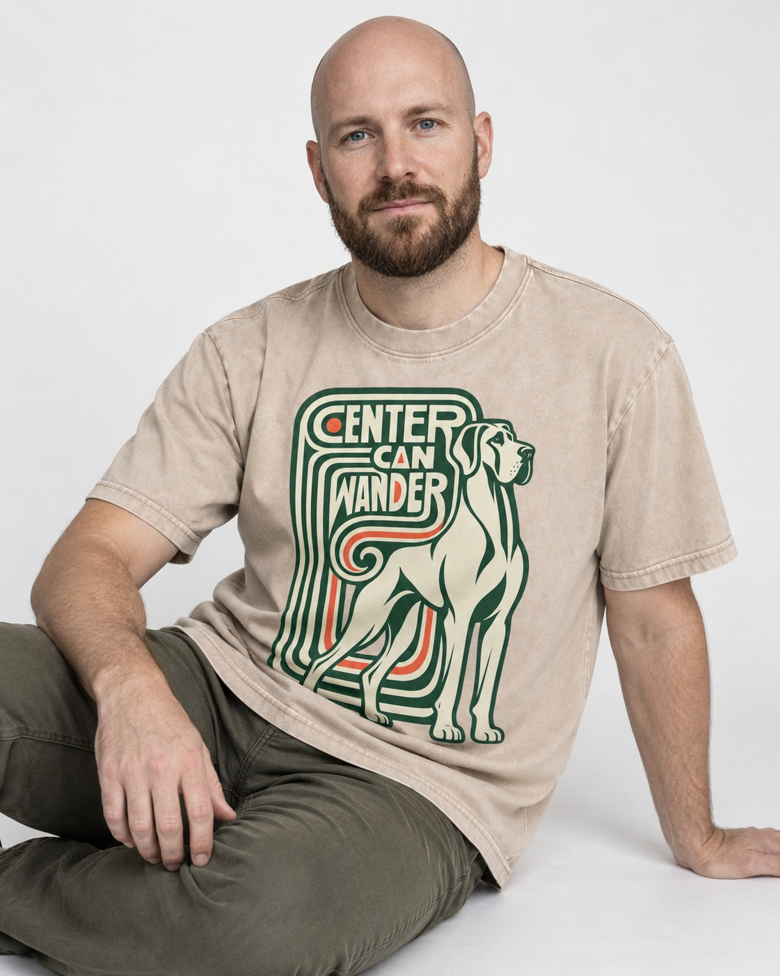 Great Dane Center Can Wander Washed Tee in Apricot, worn by a seated model