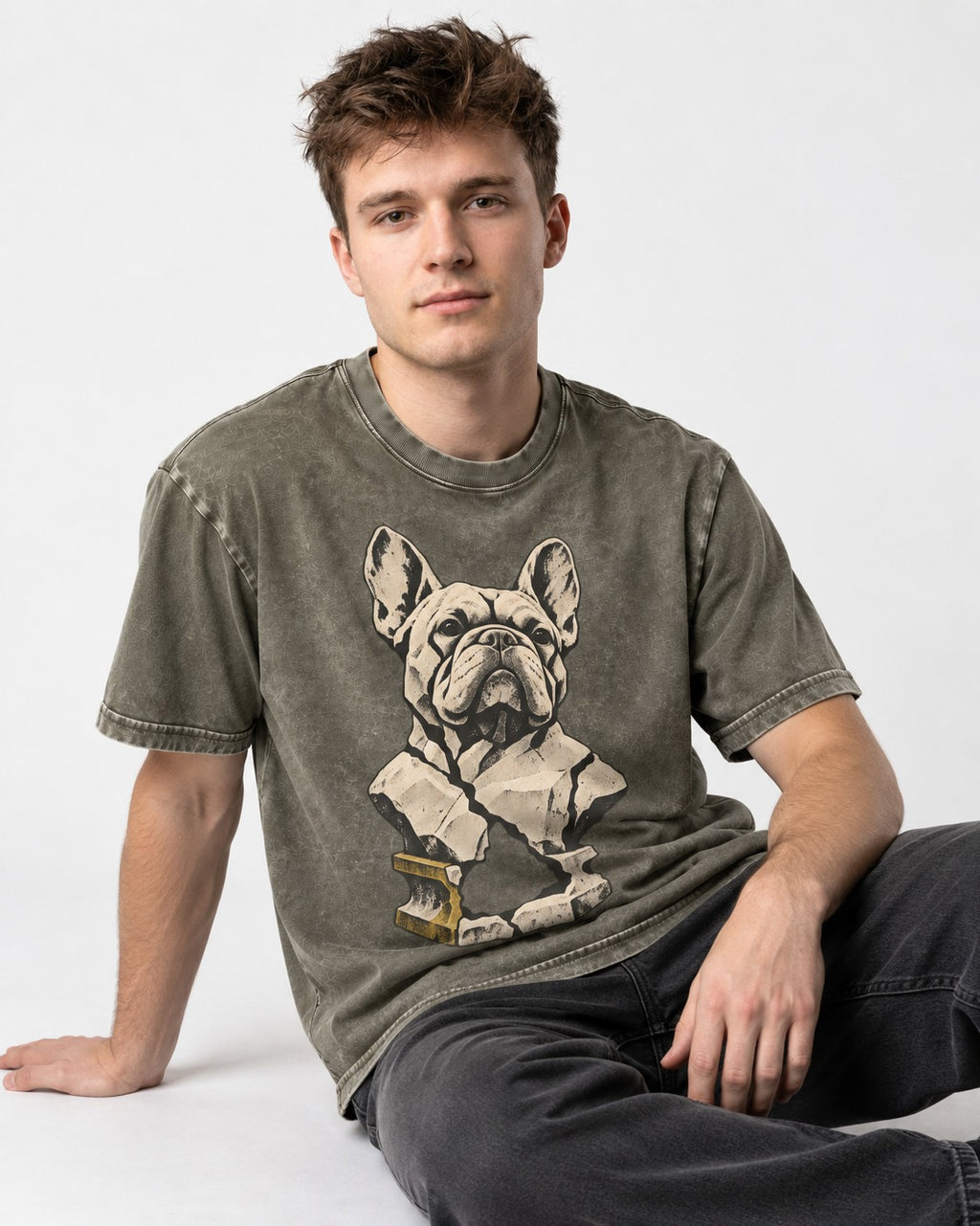Frenchie Fractured Stone Bust Graphic Washed Tee in Army Green, worn by a seated model