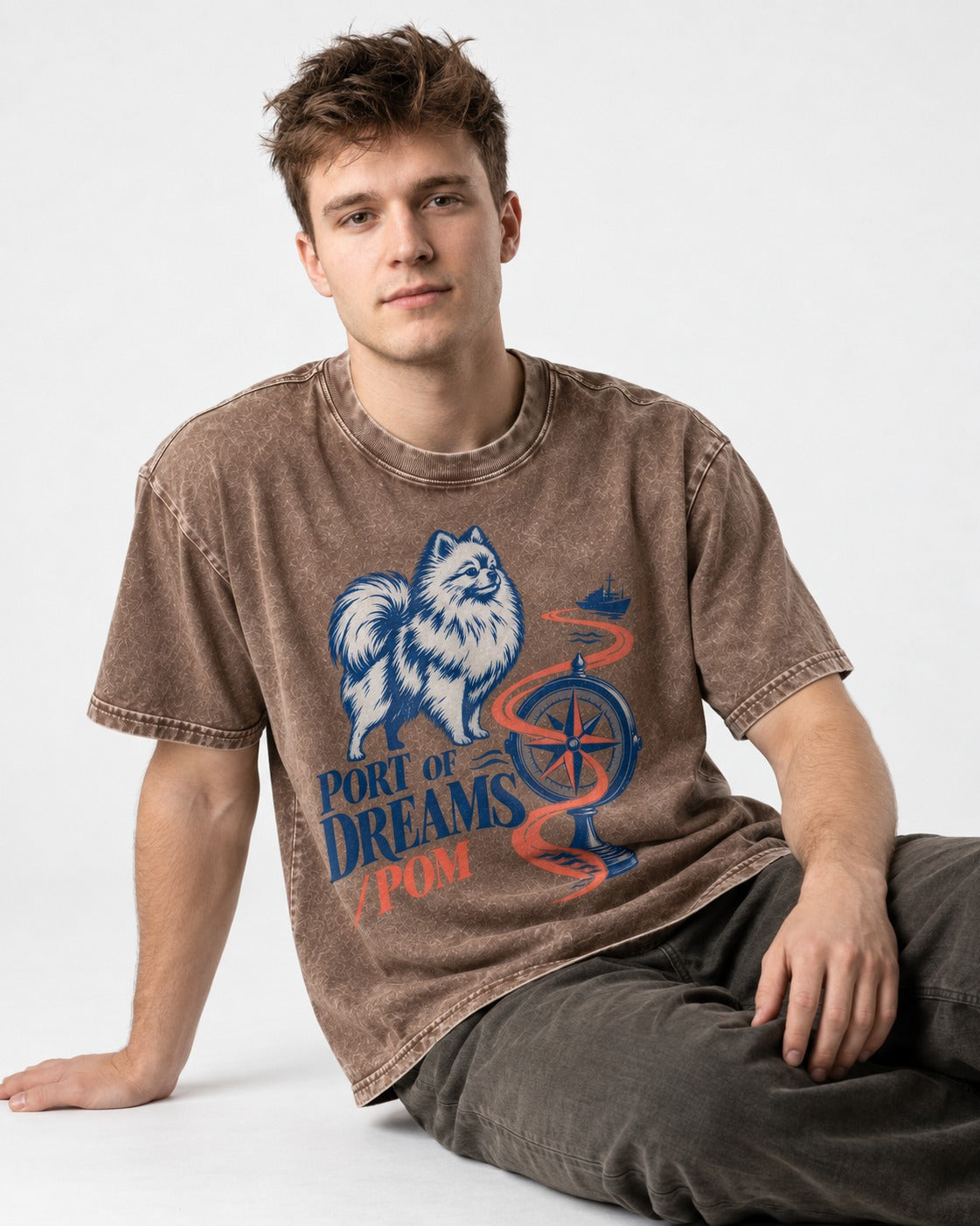 Pomeranian Port of Dreams Washed Tee in Coffee, worn by a seated model