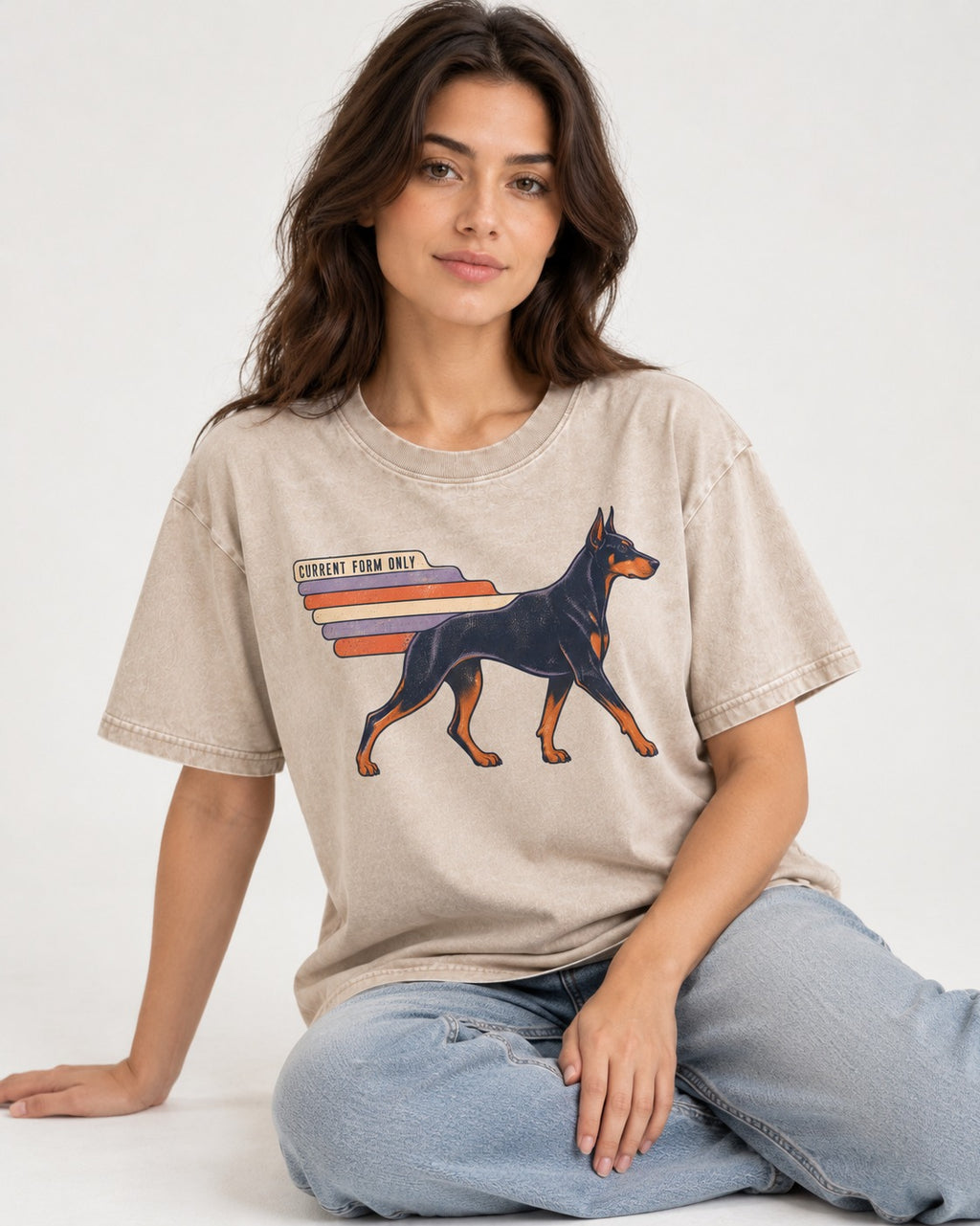 Doberman Current Form Only Speed Bars Graphic Washed Tee in Apricot, worn by a seated model