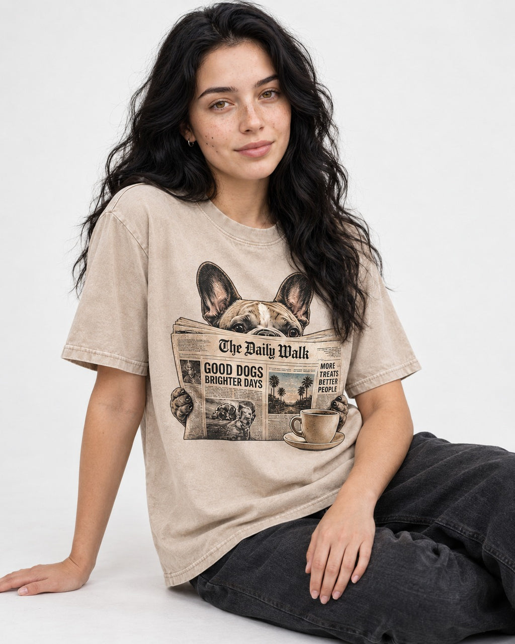 Frenchie Good Dogs Brighter Days Newspaper Graphic Washed Tee in Apricot, worn by a seated model
