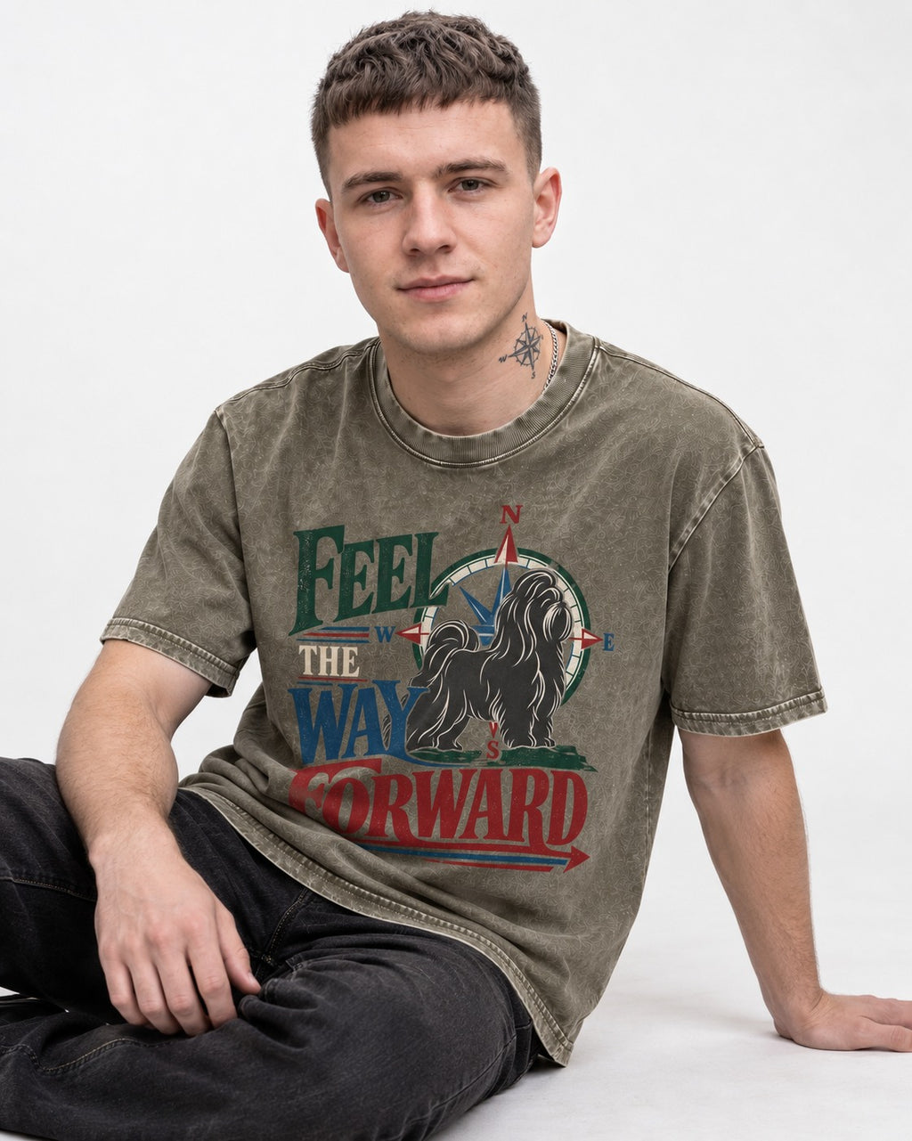 Shih Tzu Feel the Way Forward Compass Graphic Washed Tee in Army Green, worn by a seated model
