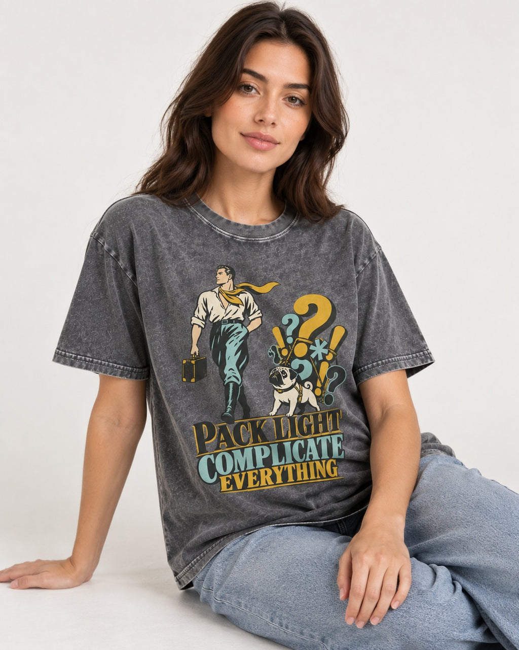 Pug Pack Light Complicate Everything Washed Tee in Gray, worn by a seated model