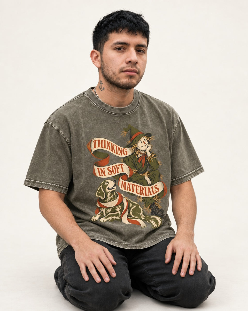 Golden Retriever Thinking in Soft Materials Scarecrow Graphic Washed Tee in Army Green, worn by a seated model