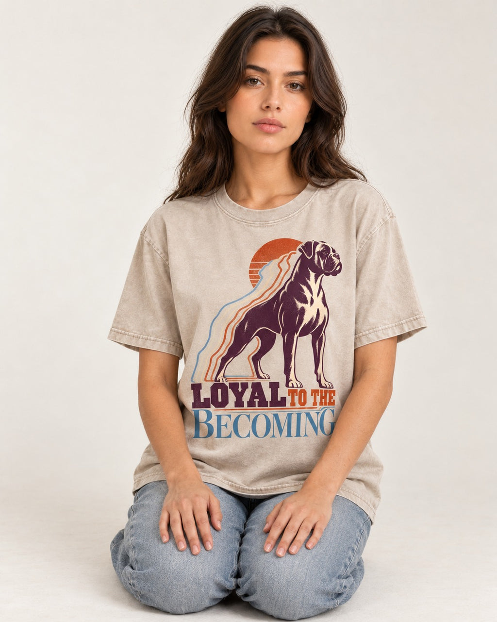 Boxer Loyal to the Becoming Washed Tee in Apricot, worn by a seated model