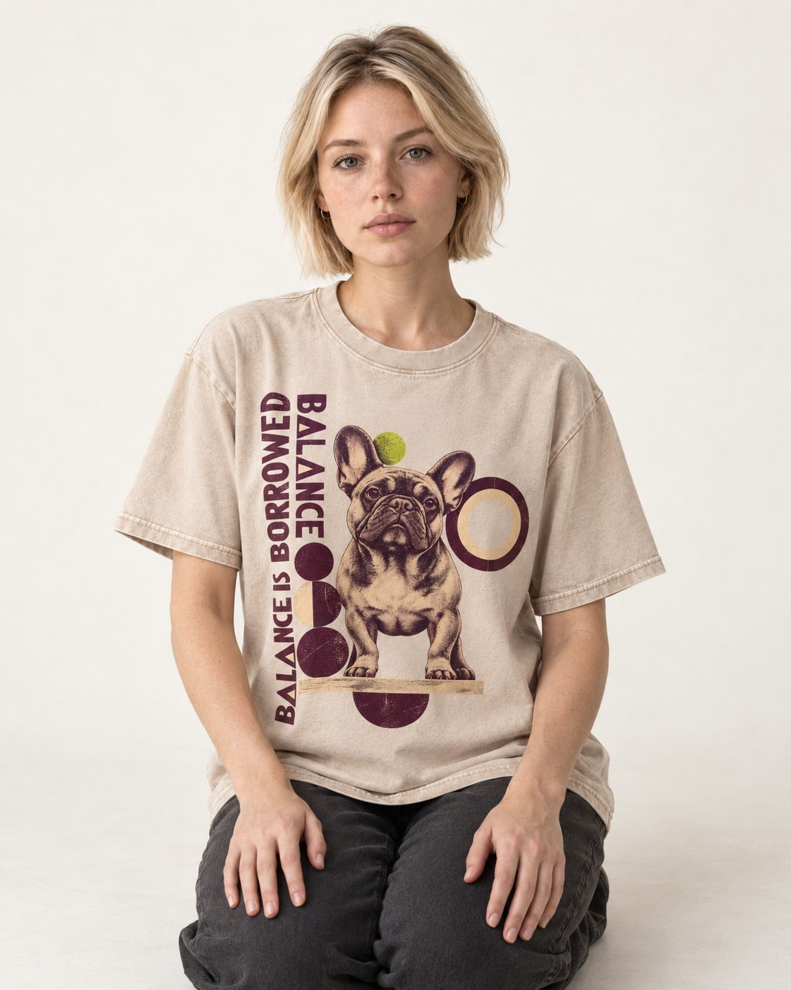 Frenchie's Balance Is Borrowed Washed Tee in Apricot, worn by a seated model
