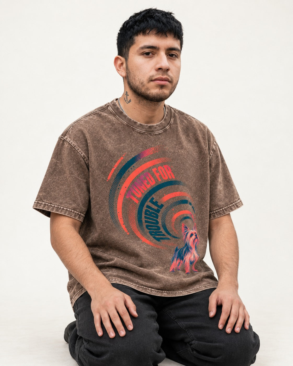 Yorkshire Terrier Tuned for Trouble Washed Tee in Coffee, worn by a seated model