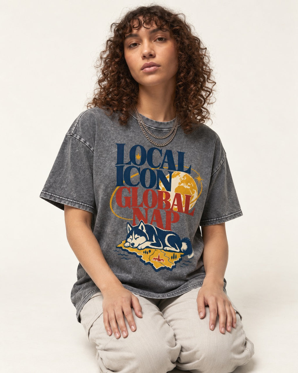 Husky Local Icon Global Nap Washed Tee in Gray, worn by a seated model