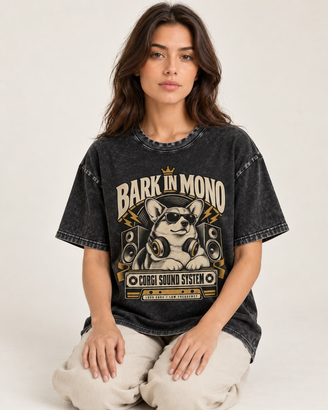Corgi Bark in Mono Sound System Washed Tee in Black, worn by a seated model