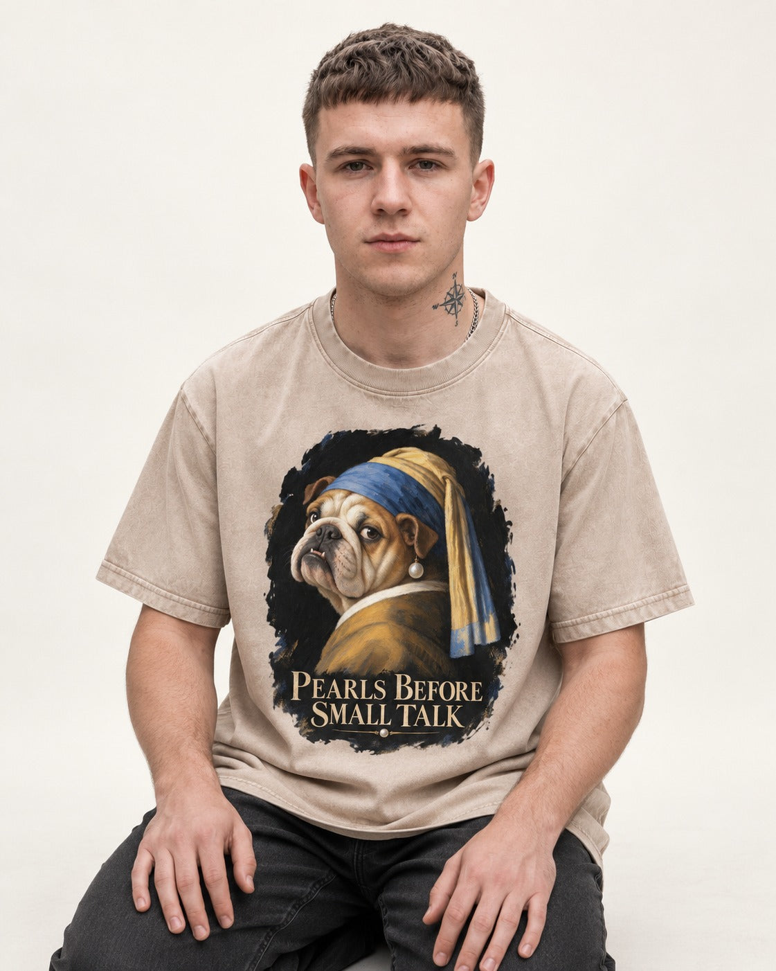 English Bulldog Pearls Before Small Talk Portrait Washed Tee in Apricot, worn by a seated model