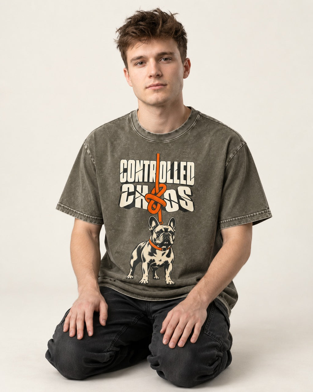 Frenchie Controlled Chaos Leash Knot Graphic Washed Tee in Army Green, worn by a seated model