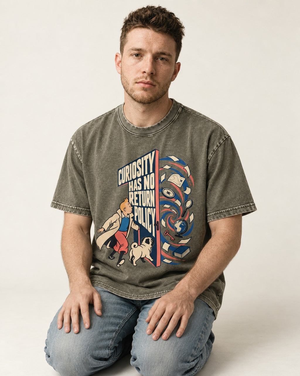 Pug Curiosity Has No Return Policy Portal Graphic Washed Tee in Army Green, worn by a seated model