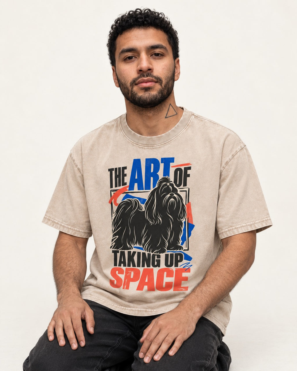 Shih Tzu Taking Up Space Washed Tee in Apricot, worn by a seated model