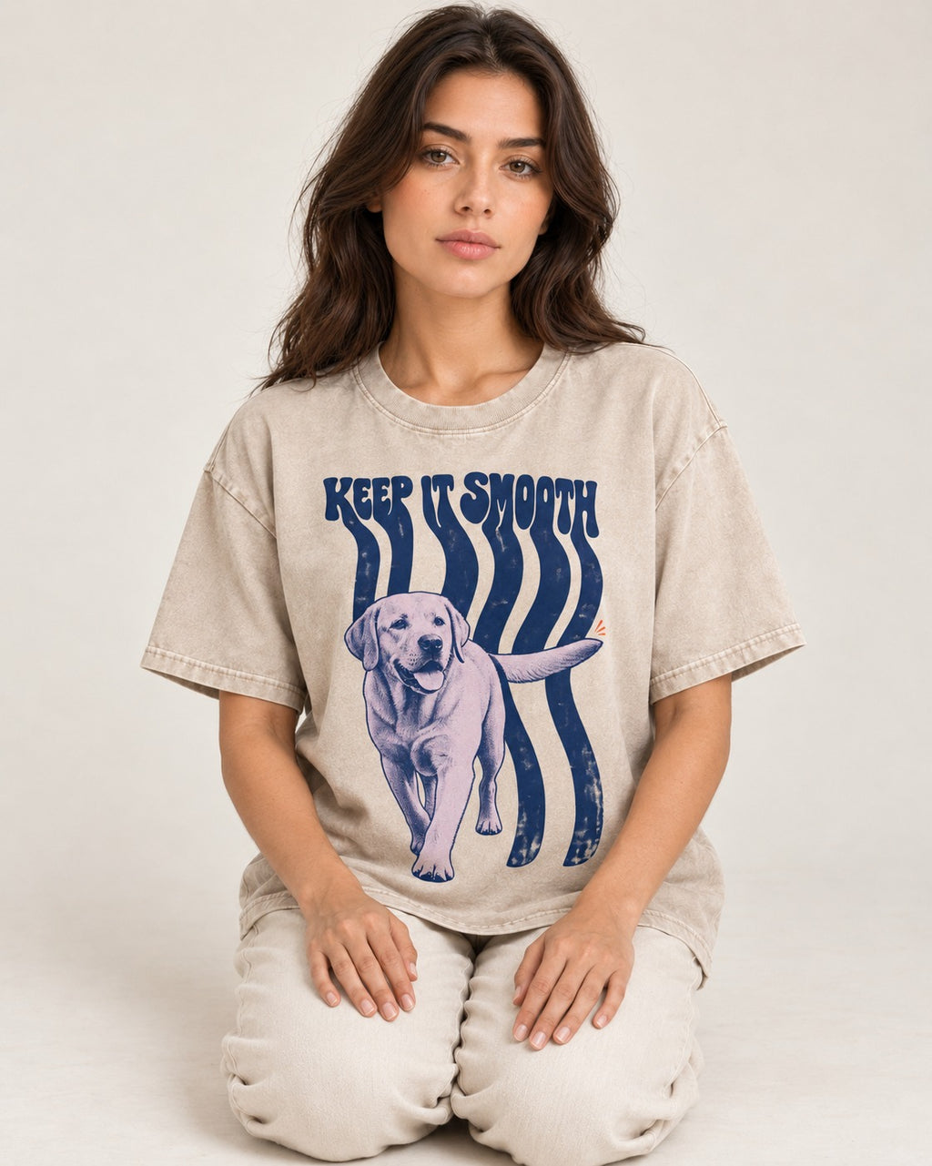 Keep It Smooth Labrador Retriever Washed Tee in Apricot, worn by a seated model