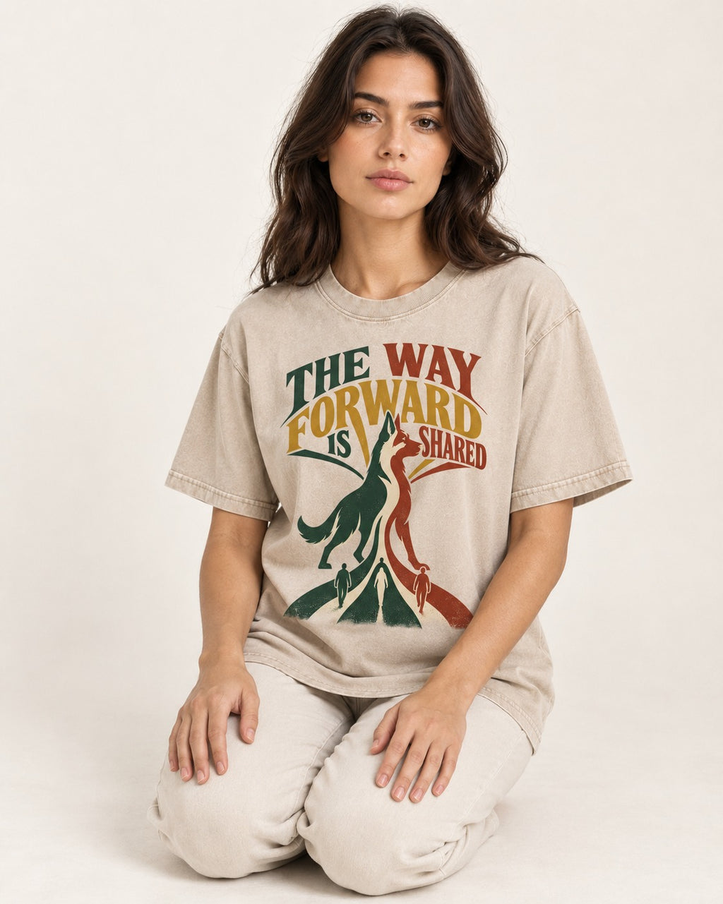 Shared Way Forward German Shepherd Dog Washed Tee in Apricot, worn by a seated model