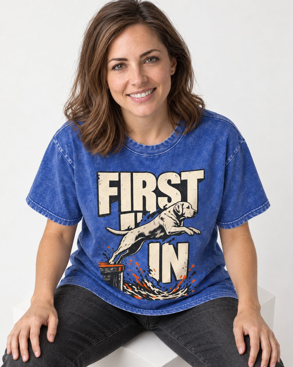First In Dock Jump Labrador Retriever Graphic Washed Tee in Royal Blue, worn by a seated model