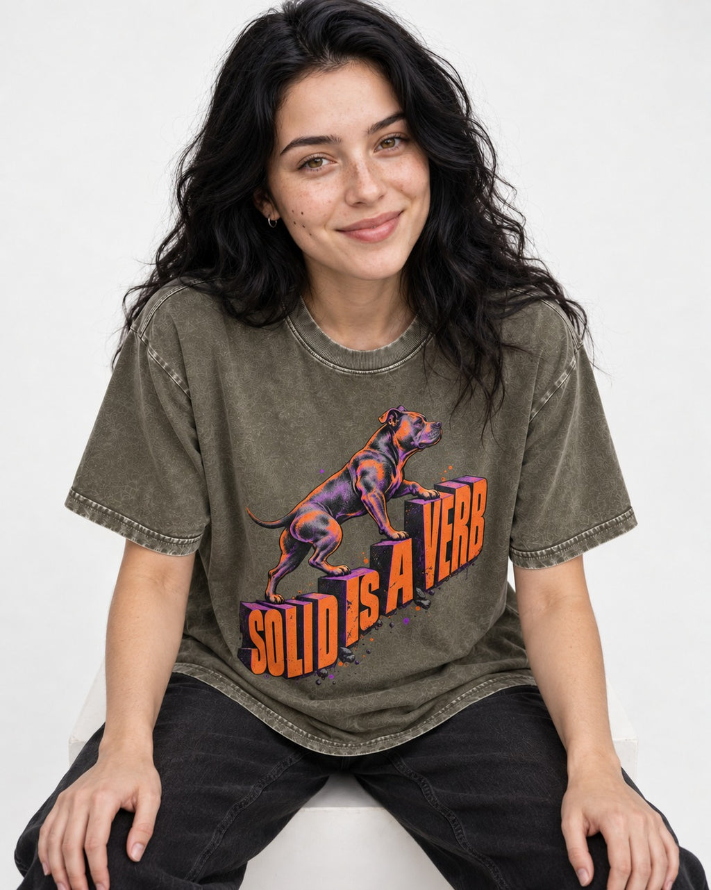 Pitbull Solid Is a Verb Step Type Graphic Washed Tee in Army Green, worn by a seated model