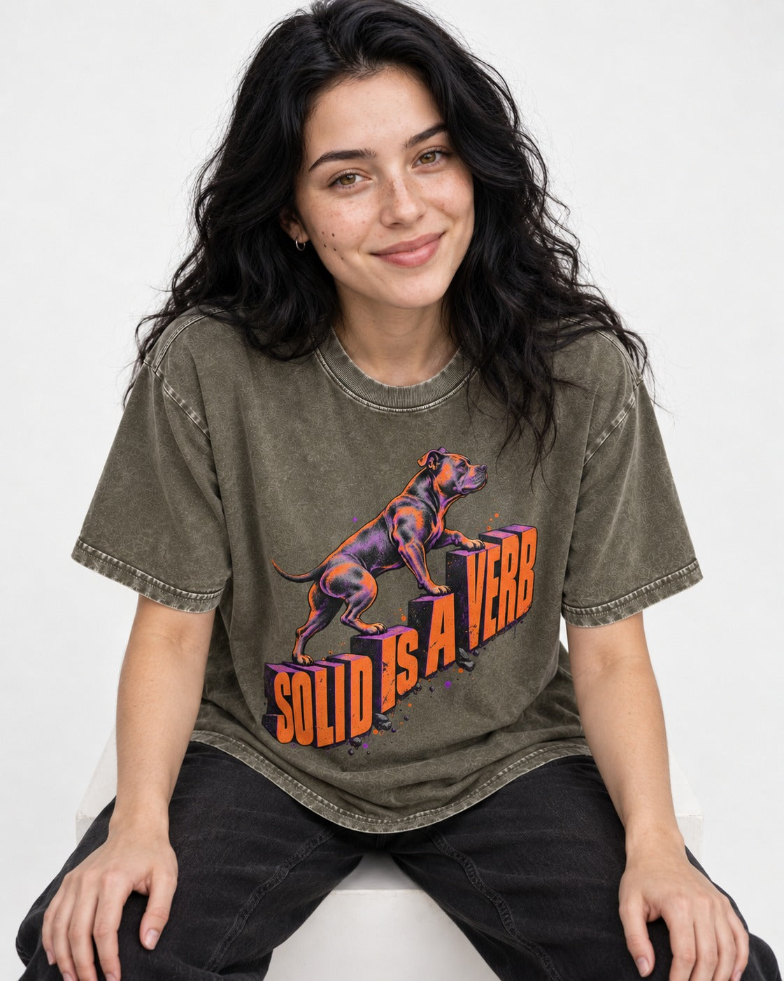 Pitbull Solid Is a Verb Step Type Graphic Washed Tee in Army Green, worn by a seated model