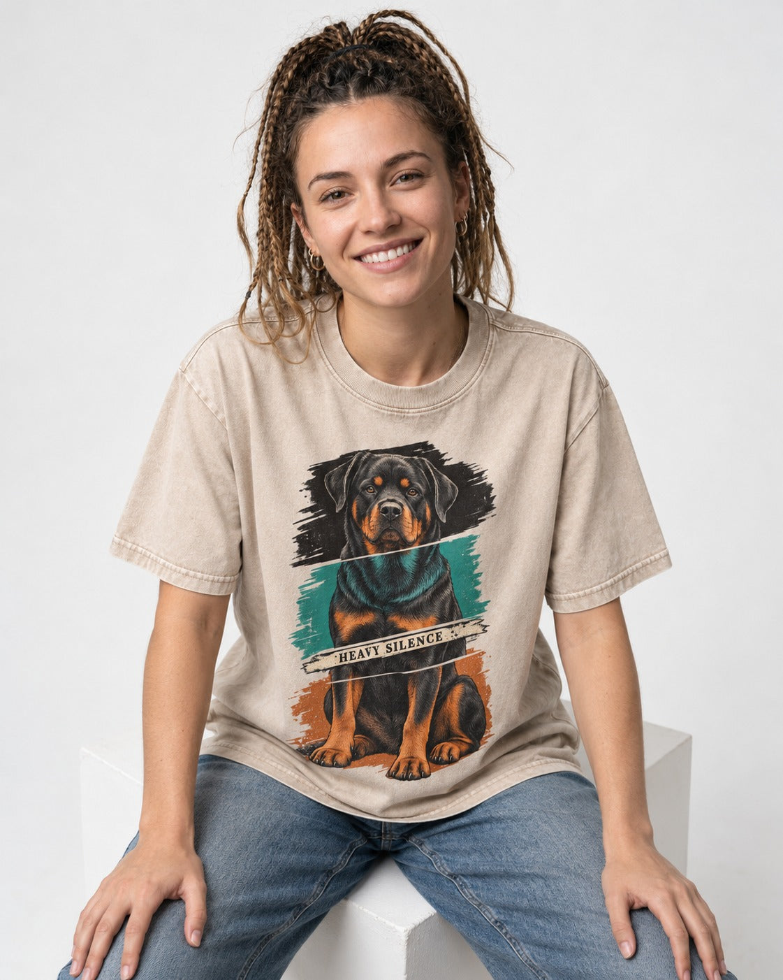 Rottweiler Heavy Silence Brushstroke Portrait Graphic Washed Tee in Apricot, worn by a seated model