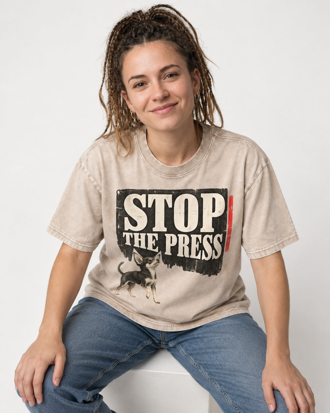 Stop the Press Chihuahua Washed Tee in Apricot, worn by a seated model