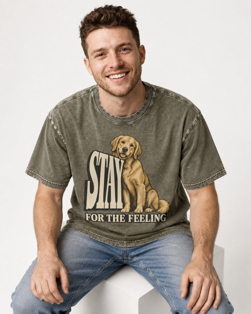 Golden Retriever Stay for the Feeling Leaning Puppy Graphic Washed Tee in Army Green, worn by a seated model