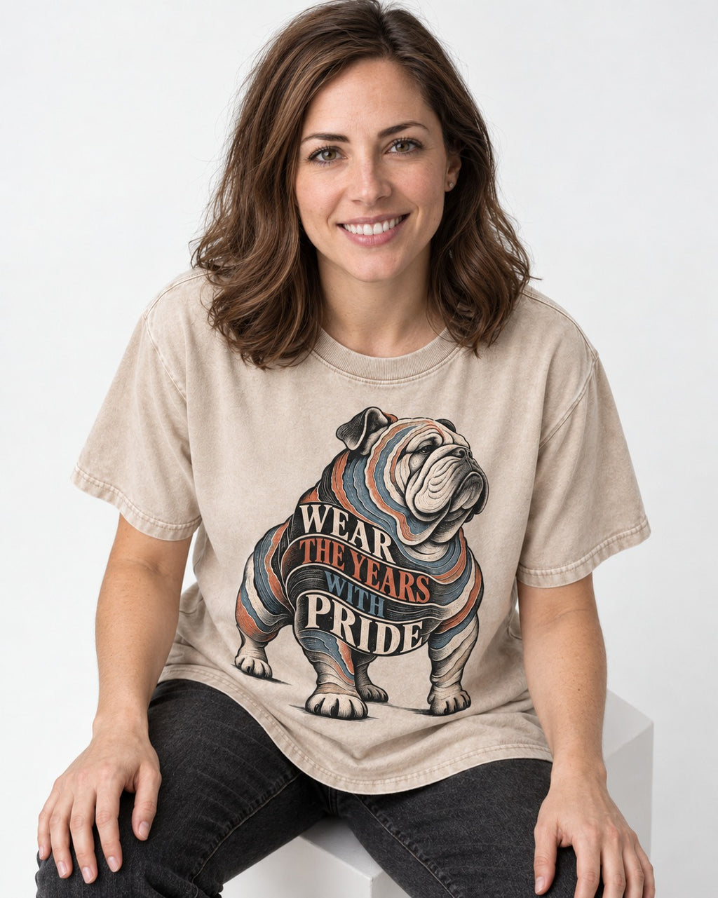 English Bulldog Wear the Years Washed Tee in Apricot, worn by a seated model